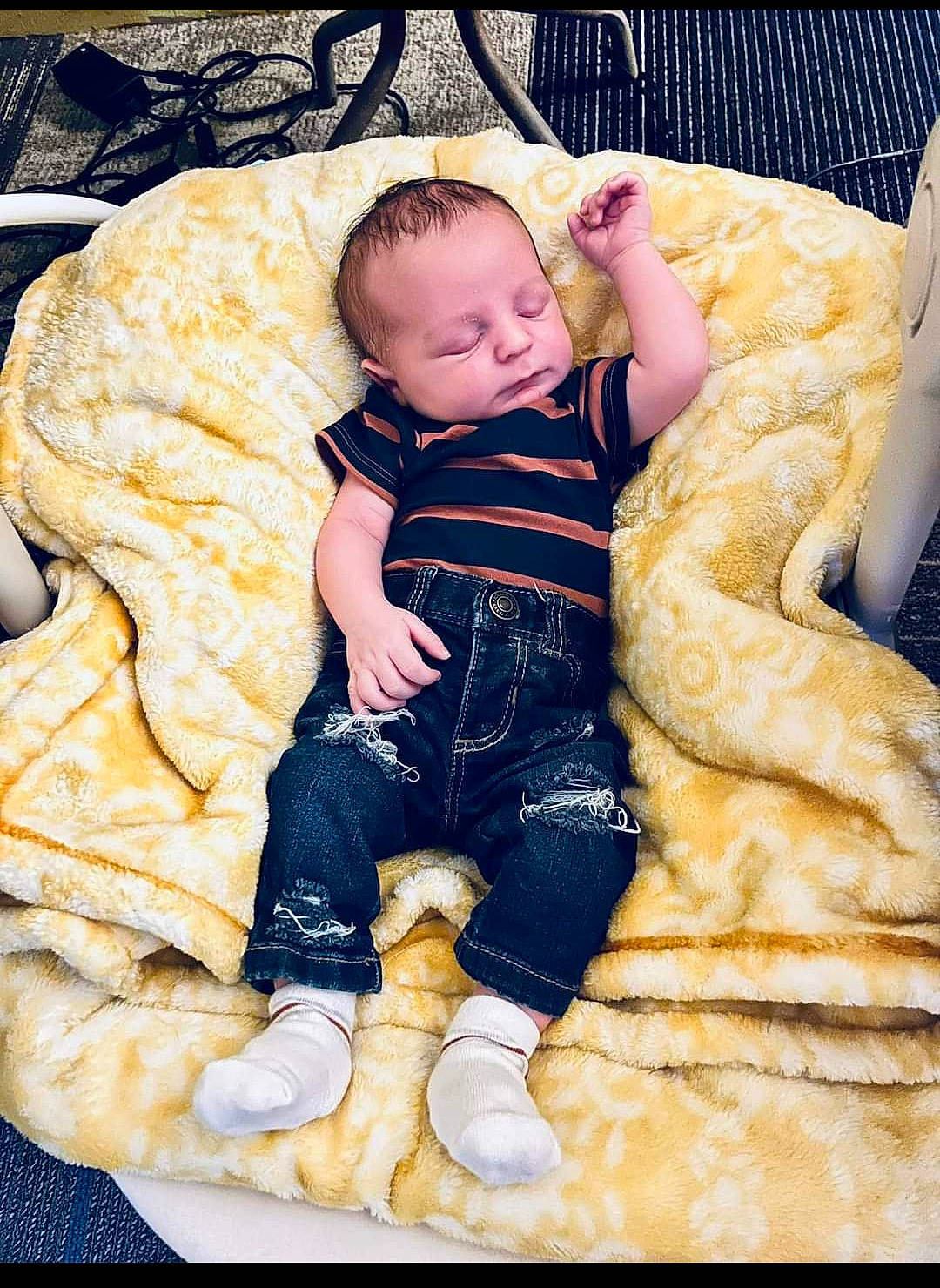 Lyric is registered to the contest to win money with this photo: abdomen, baby, baby_products, baby_toddler_clothing, bedding, cheek, child, comfort, couch, fun, head, lap, linens, pattern, person, room, sitting, sleeve, sock, throw_pillow
