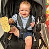 Cade joined the competition — help win amazing prizes! baby, stroller, shoe, smile, child, blue_eyes, shorts, shirt, sock, shopping, store, aisle, floor, seatbelt, harness, playful, cute, infant, person, indoor