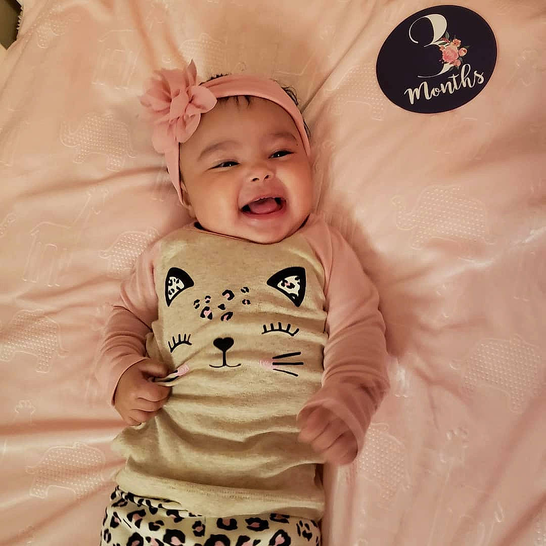 Cydney joined the competition — help win amazing prizes! baby, baby_laughing, baby_toddler_clothing, cheek, face, facial_expression, finger, font, happy, headwear, mouth, neck, pattern, person, pink, skin, sleeve, smile, t_shirt, textile