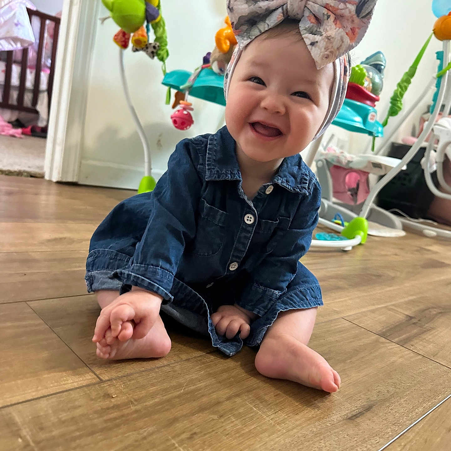 Naomi is registered to the contest to win money with this photo: baby, babycrawling, babylaughing, bed, clothing, crawling, face, furniture, happy, hardwood, head, jeans, pants, person, photography, portrait, sitting, sleeve, smile, wood