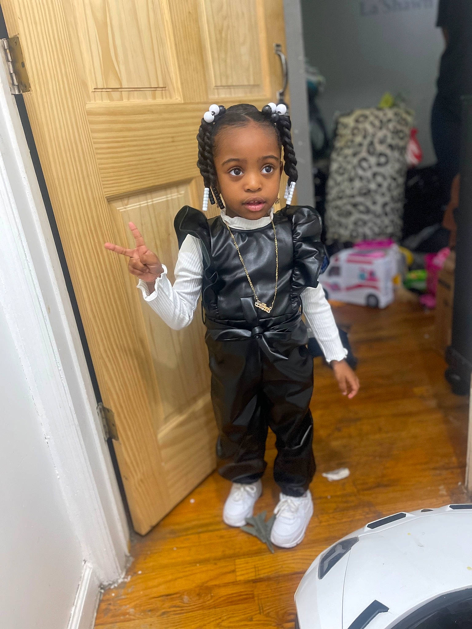 Lashawn joined the competition — help win amazing prizes! bag, chair, child, doll, door, fashion_accessory, fashion_design, flooring, football, formal_wear, fun, hardwood, pattern, person, room, sitting, sleeve, toddler, toy, waist