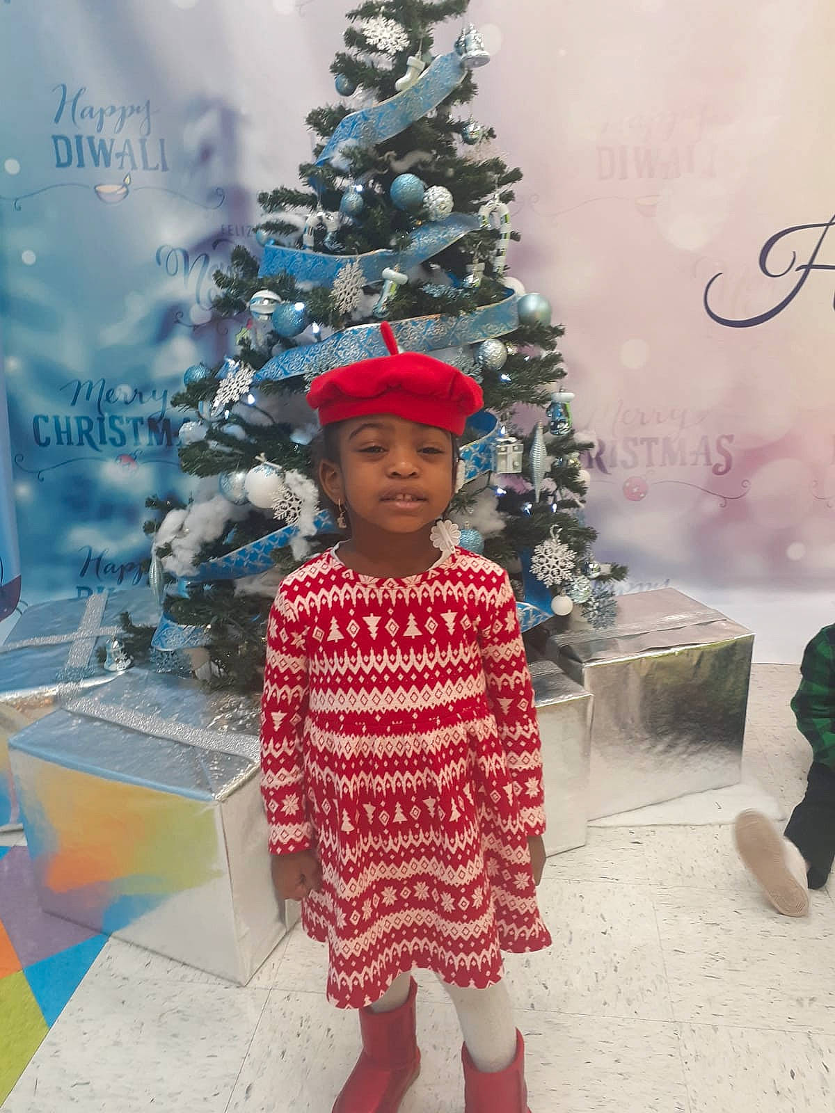 Lashawn is registered to the contest to win money with this photo: baby_toddler_clothing, child, christmas, christmas_decoration, christmas_eve, christmas_ornament, christmas_tree, conifer, event, fun, happy, headwear, holiday, holiday_ornament, ornament, person, pink, standing, toddler, tradition