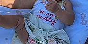Nalah joined the competition — help win amazing prizes! baby, blanket, clothing, cushion, dress, face, furniture, grass, head, homedecor, lawn, outdoors, person, photography, plant, portrait, quilt, shorts, summer, t_shirt