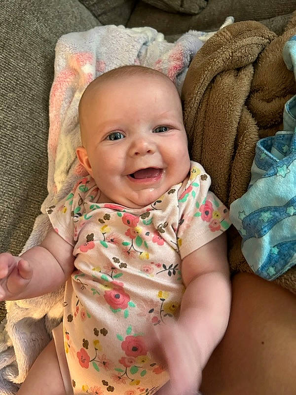 Taylor joined the competition — help win amazing prizes! baby, baby_toddler_clothing, cheek, chin, collar, comfort, eye, face, head, human_body, iris, joy, lip, mouth, nose, person, pink, skin, sleeve, smile
