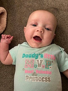 Taylor joined the competition — help win amazing prizes! baby, baby_toddler_clothing, cheek, chin, cool, eyebrow, finger, gesture, happy, head, mammal, mouth, neck, nose, person, pink, skin, sleeve, smile, t_shirt