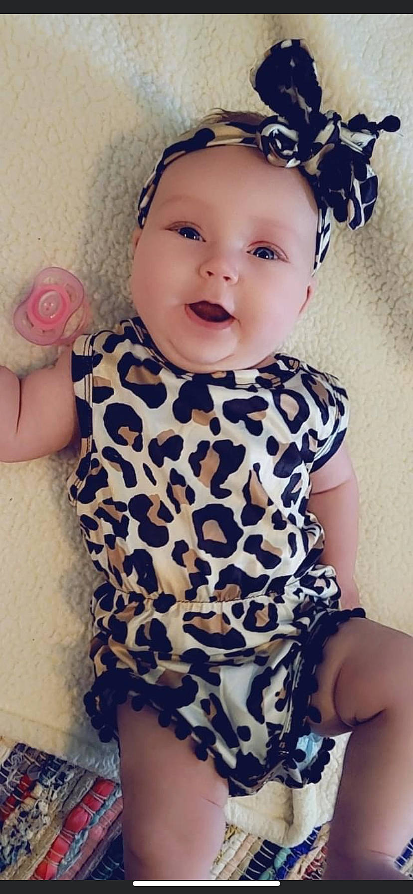 Paisley is registered to the contest to win money with this photo: baby_toddler_clothing, day_dress, eye, facial_expression, hairstyle, happy, head, iris, lip, neck, one_piece_garment, organ, outerwear, person, pink, purple, skin, sleeve, smile, standing