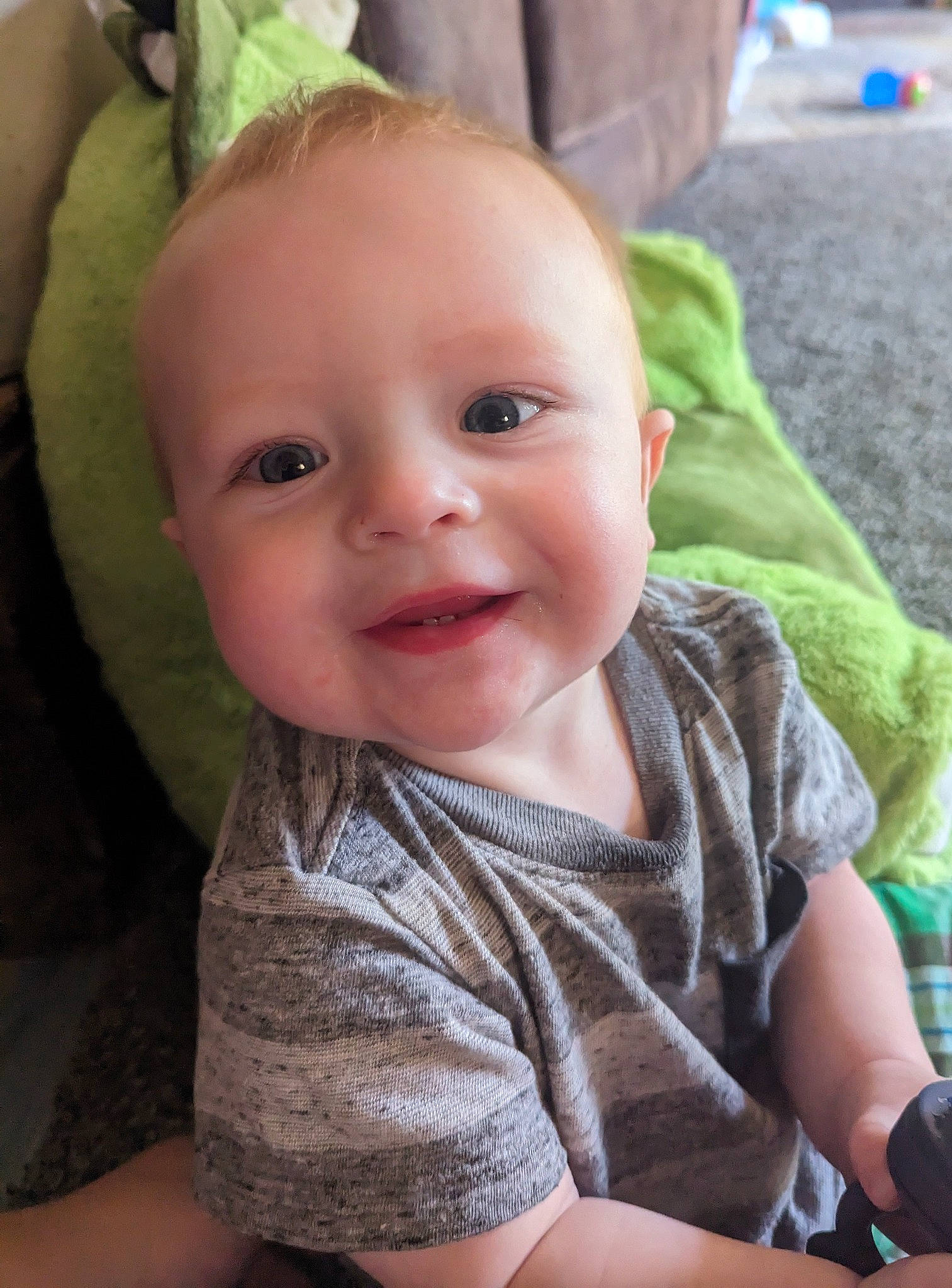 Jaxon is registered to the contest to win money with this photo: baby, baby_toddler_clothing, cheek, eye, eyebrow, facial_expression, fun, grass, happy, human_body, iris, joy, lip, mouth, nose, person, plant, skin, sleeve, smile