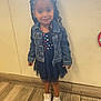 Alani is registered to the contest to win money with this photo: child, girl, denim_jacket, dress, stars_pattern, red_bow, sneakers, indoor, wood_floor, wall, standing, cute, portrait, fashion, hair, smiling, person, clothing, feet, young