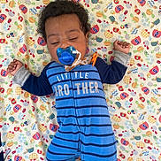 Azon is registered to the contest to win money with this photo: baby, child, pacifier, blue_onesie, striped_clothing, sleeping, blanket, patterned_blanket, infant, toddler, cute, lying_down, sleepy, indoors, soft_fabric, young_child, hands_up, closed_eyes, comfort, nap_time