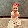 baby, child, infant, smiling, happy, clapping, bow, headband, carpet, floor, sitting, cute, clothing, indoor, person, face, expression, young, toddler, background