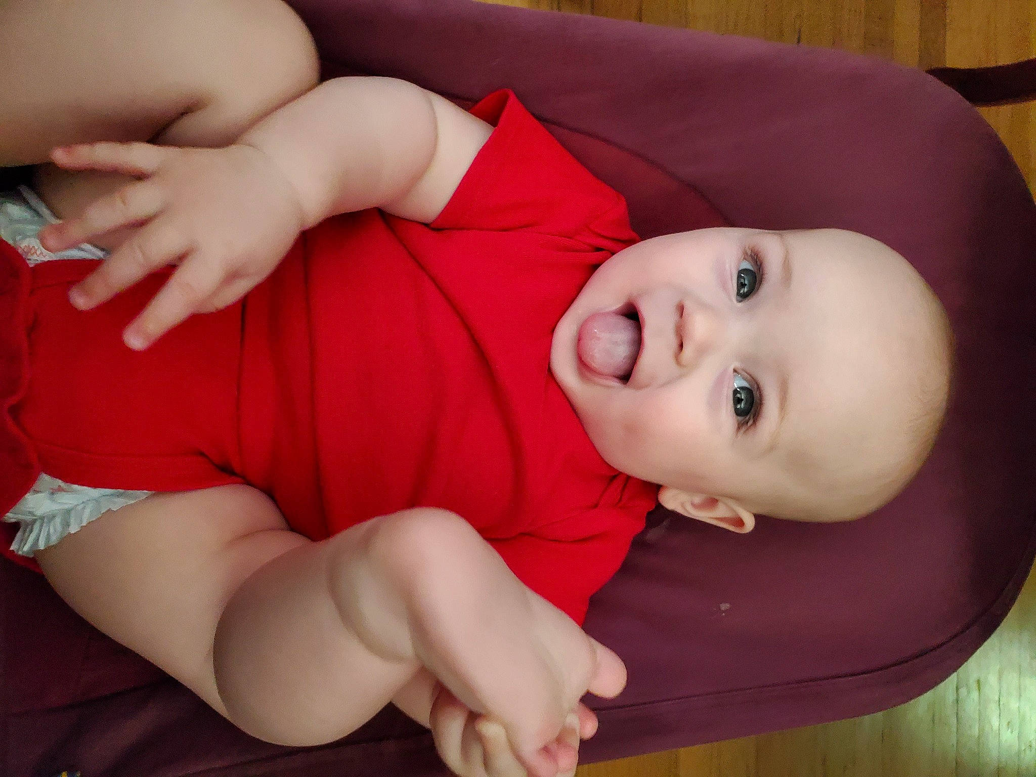 Matthew is registered to the contest to win money with this photo: baby, baby_toddler_clothing, cheek, child, comfort, elbow, eyelash, finger, flooring, human_leg, joint, lip, mouth, nose, pattern, person, skin, sleeve, smile, toddler