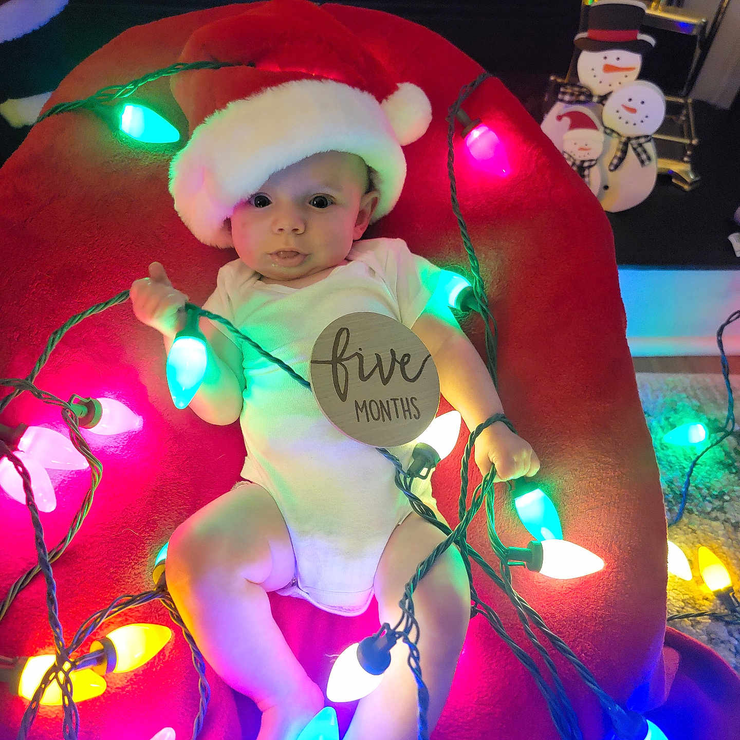 Wesley is registered to the contest to win money with this photo: baby, bonnet, cap, clothing, costume, electricaldevice, electronics, face, festival, hat, head, inflatable, light, lighting, microphone, person, photography, portrait, purple, sphere