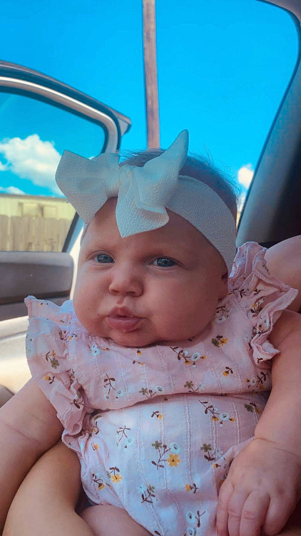 Blakelyn is registered to the contest to win money with this photo: baby, baby_toddler_clothing, cap, cheek, child, chin, cool, face, facial_expression, fun, gesture, grass, happy, headgear, headwear, person, pink, skin, sky, sun_hat