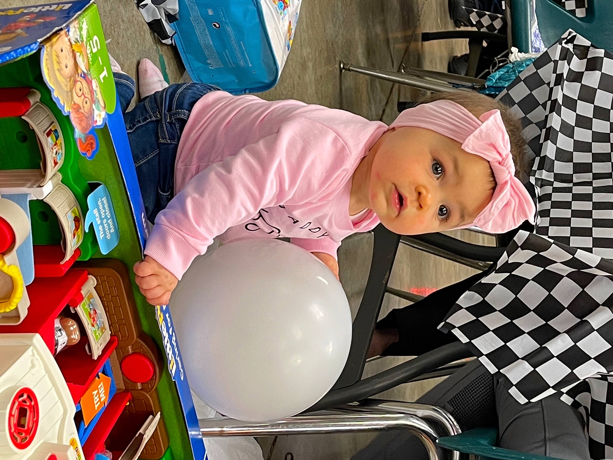 Ada joined the competition — help win amazing prizes! baby, baby_toddler_clothing, balloon, headwear, party_supply, person, plastic, surprise
