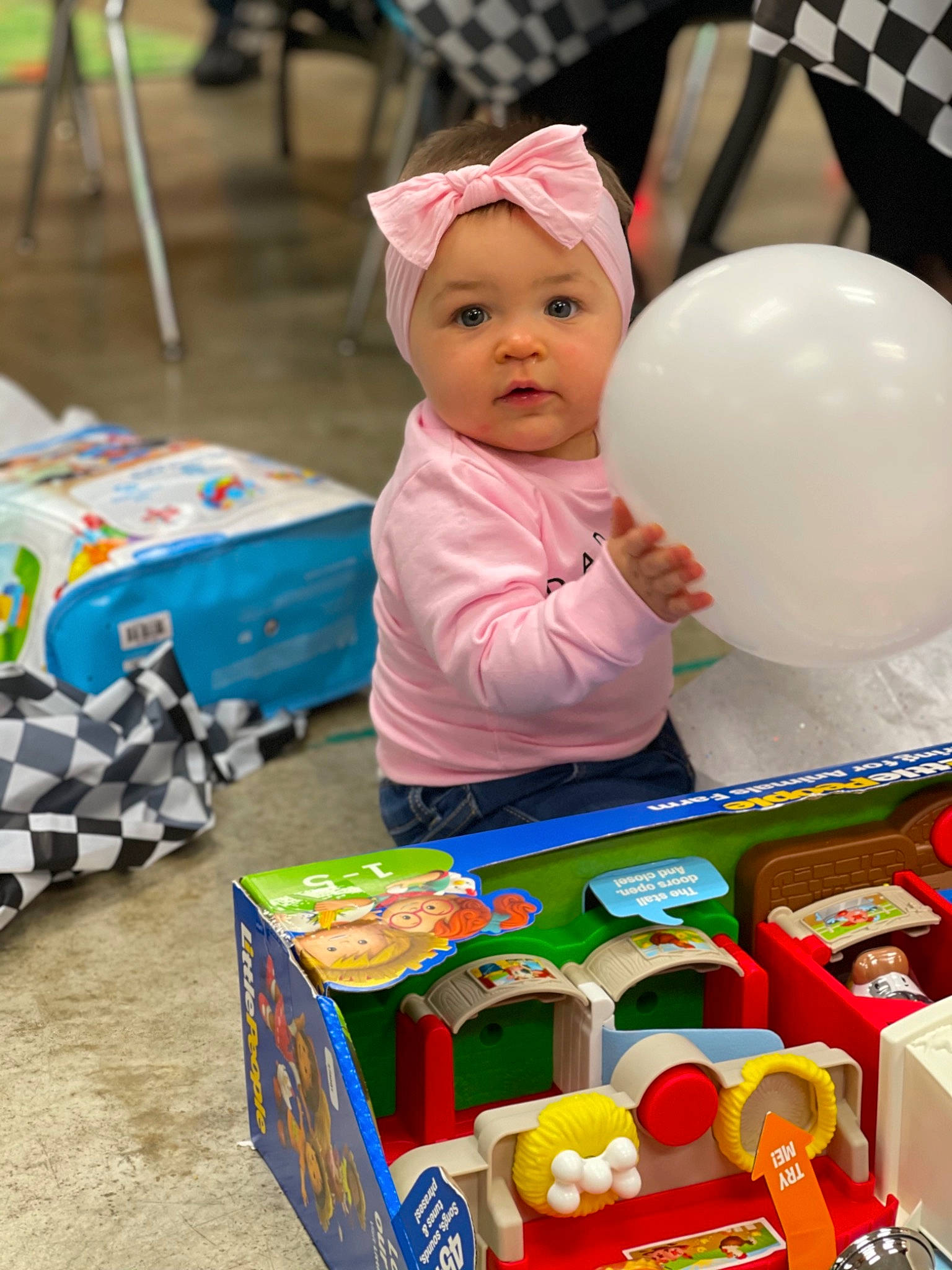 Ada is registered to the contest to win money with this photo: baby, baby_products, baby_toddler_clothing, baby_toys, balloon, box, child, educational_toy, headwear, nose, party_supply, person, plastic, play, toddler