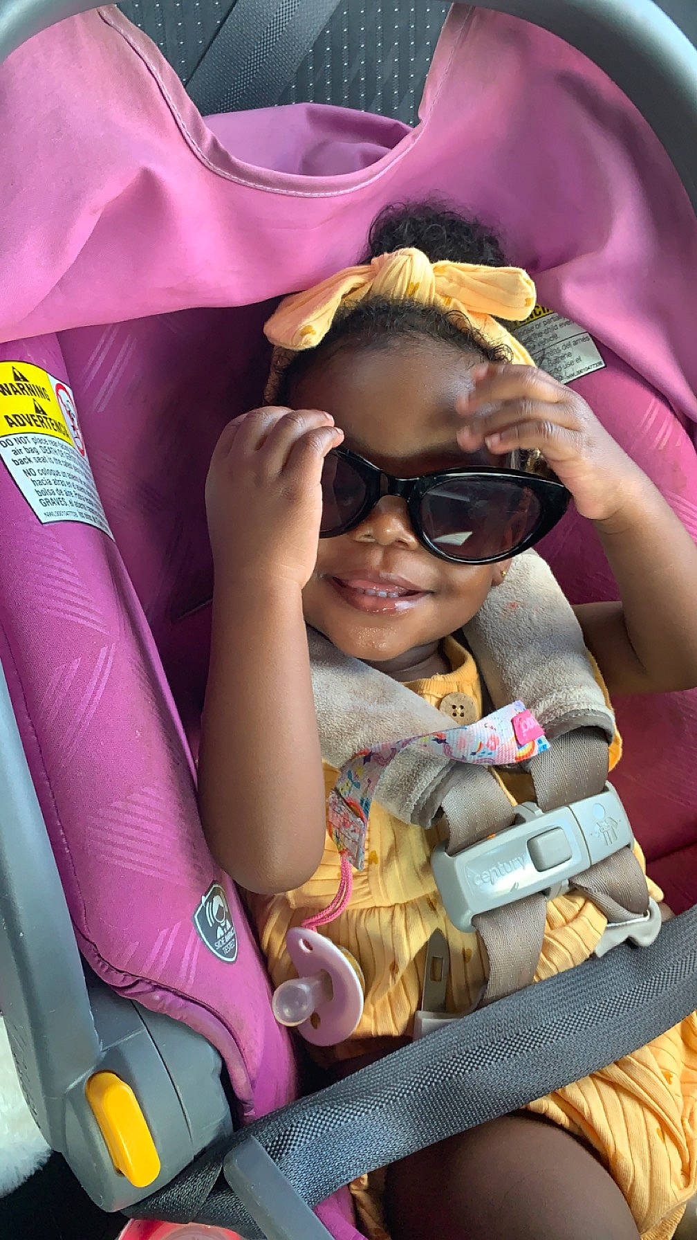 Aliza joined the competition — help win amazing prizes! car_seat, child, eyewear, fun, goggles, happy, joy, leisure, mammal, person, pink, product, public_space, purple, recreation, skin, smile, sunglasses, toddler, travel