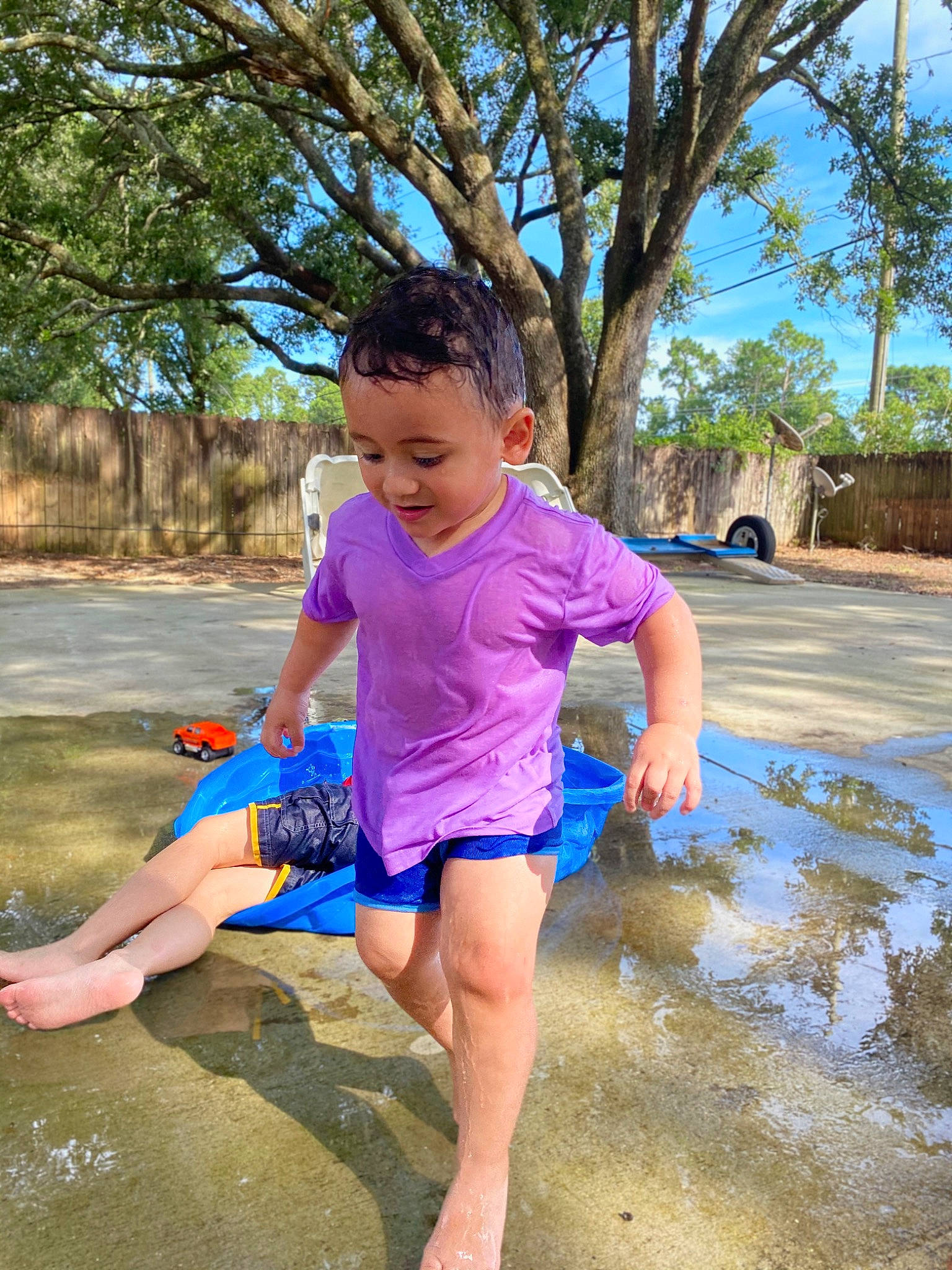 Brayson is registered to the contest to win money with this photo: barefoot, child, fun, leisure, person, play, recreation, smile, summer, toddler, tree, vacation, water