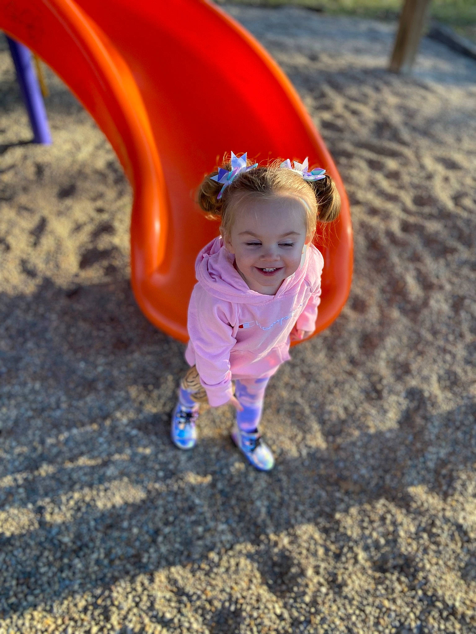 Esmae is registered to the contest to win money with this photo: baby_toddler_clothing, child, chute, city, electric_blue, fun, grass, happy, joy, leisure, outdoor_play_equipment, people_in_nature, person, play, playground, playground_slide, recreation, smile, soil, toddler
