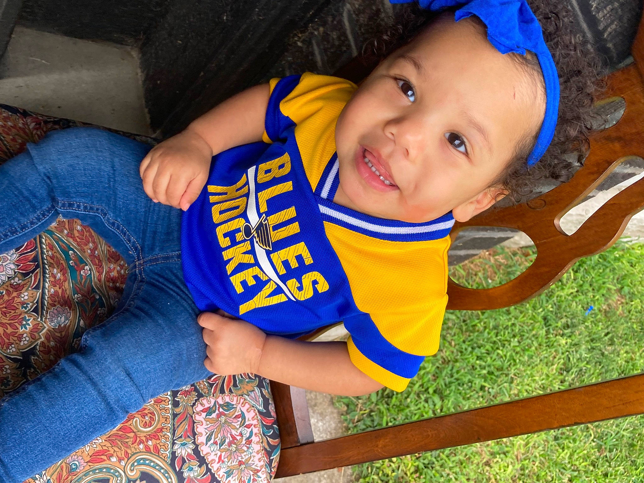 Levin is registered to the contest to win money with this photo: baby_toddler_clothing, blue, child, electric_blue, eye, face, finger, fun, grass, hair, happy, head, leisure, nose, person, plant, smile, t_shirt, toddler, tree