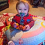 toddler, child, pacifier, toy, cushion, blanket, indoor, smiling, happy, clothing, floor, person, face, baby, playtime, colorful, comfort, sitting, cute, warm