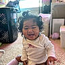 Amerie is registered to the contest to win money with this photo: baby, carpet, child, cozy, curly_hair, cute, face, happy, home, indoor, infant, laughing, natural_light, person, pink_socks, playful, sitting, smiling, toddler, white_clothing