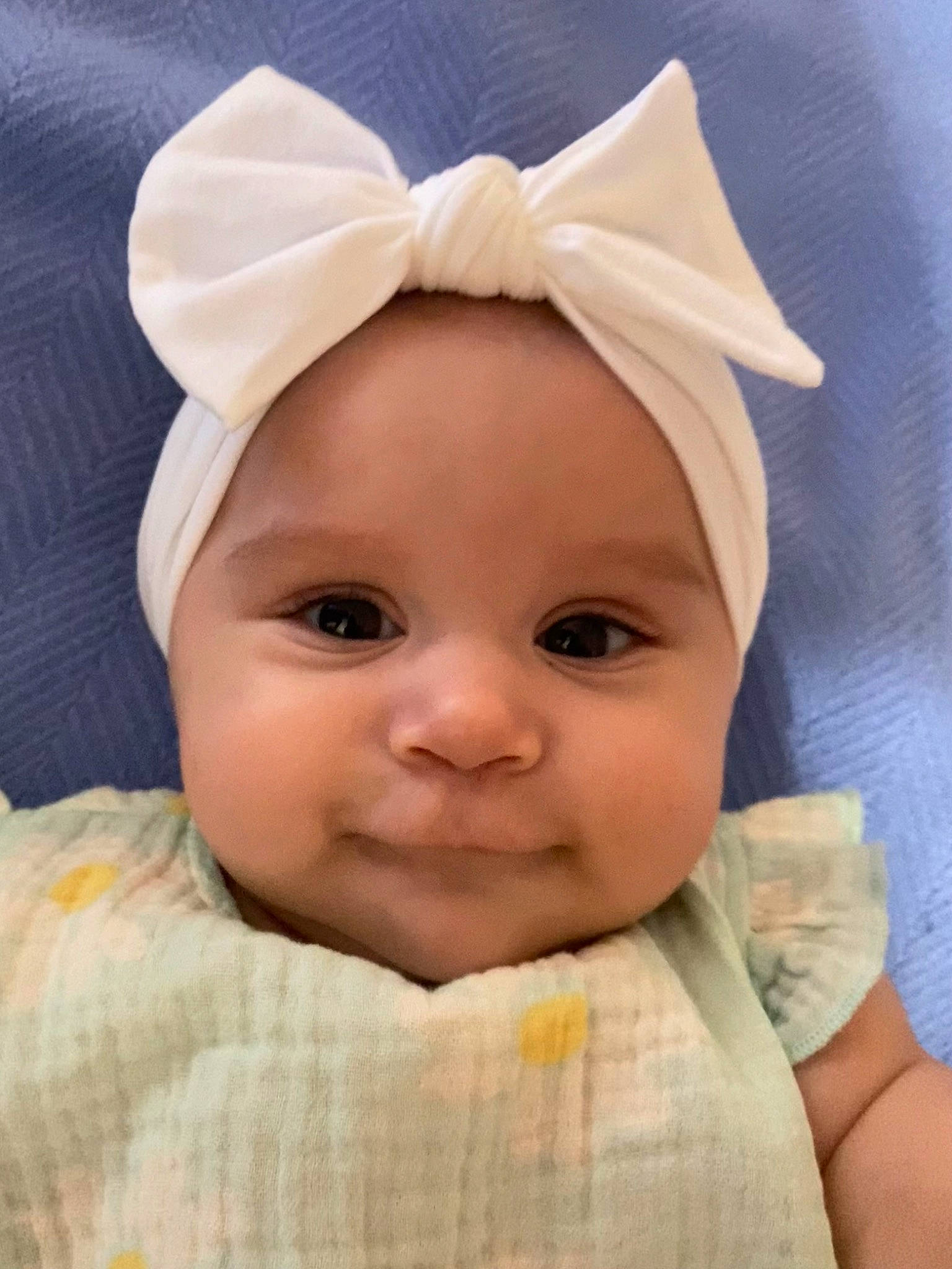 Leila joined the competition — help win amazing prizes! baby, baby_toddler_clothing, bonnet, cheek, child, comfort, eye, eyelash, fashion_accessory, happy, linens, lip, no_expression, nose, peach, person, portrait_photography, skin, sleeve, smile