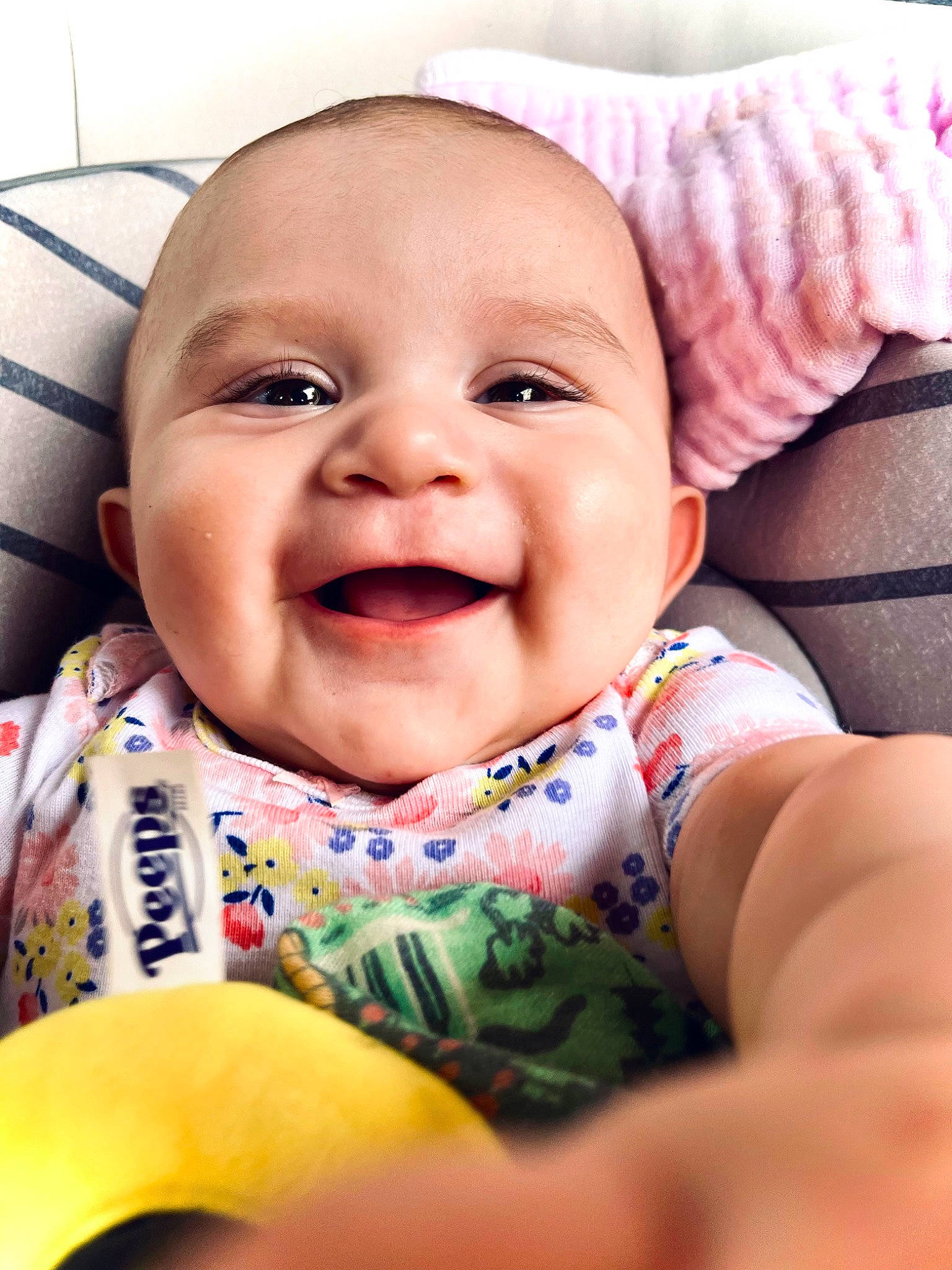 Leila is registered to the contest to win money with this photo: baby, baby_laughing, baby_toddler_clothing, cheek, chin, comfort, eye, face, facial_expression, finger, happy, iris, lip, mouth, nose, person, pink, skin, sleeve, smile
