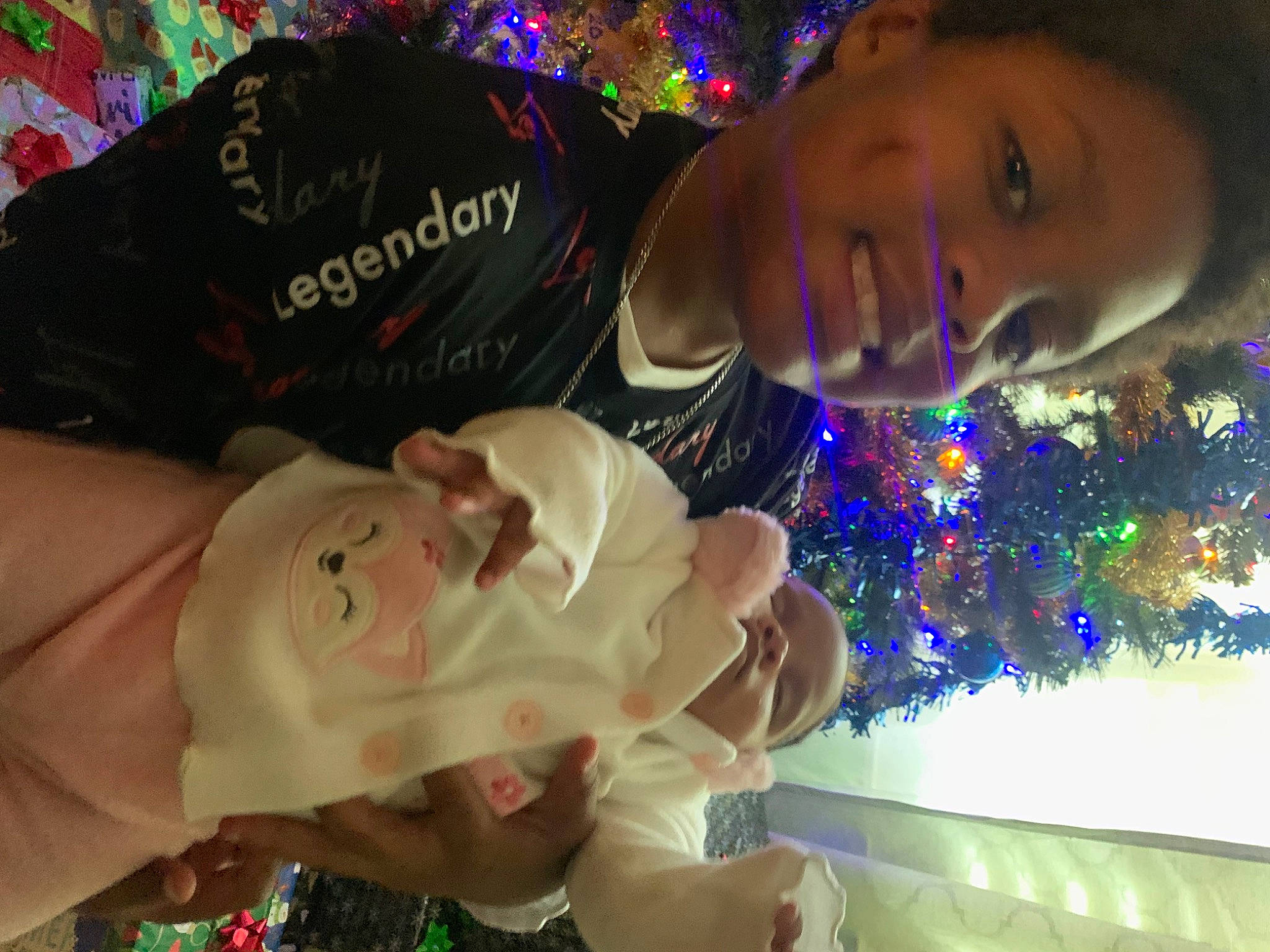 Majustici is registered to the contest to win money with this photo: child, christmas_decoration, christmas_eve, christmas_ornament, christmas_tree, conifer, event, fun, green, happy, head, holiday, human_body, interior_design, joy, ornament, person, plant, smile, tradition