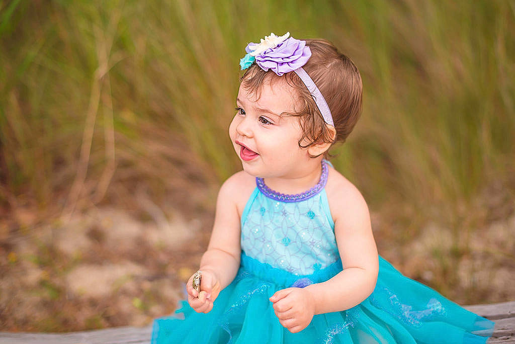 Shelby joined the competition — help win amazing prizes! aqua, azure, baby_toddler_clothing, clothing, dress, flash_photography, fun, grass, green, happy, iris, leaf, nature, people_in_nature, person, photograph, pink, purple, skin, smile