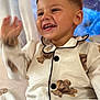 Emilio a rejoint le concours — aidez-le/la à gagner de superbes lots ! child, toddler, smiling, waving, pajamas, teddy_bear, happy, cute, indoors, portrait, face, clothing, buttoned_shirt, short_hair, expression, joyful, person, sitting, background, warm_light