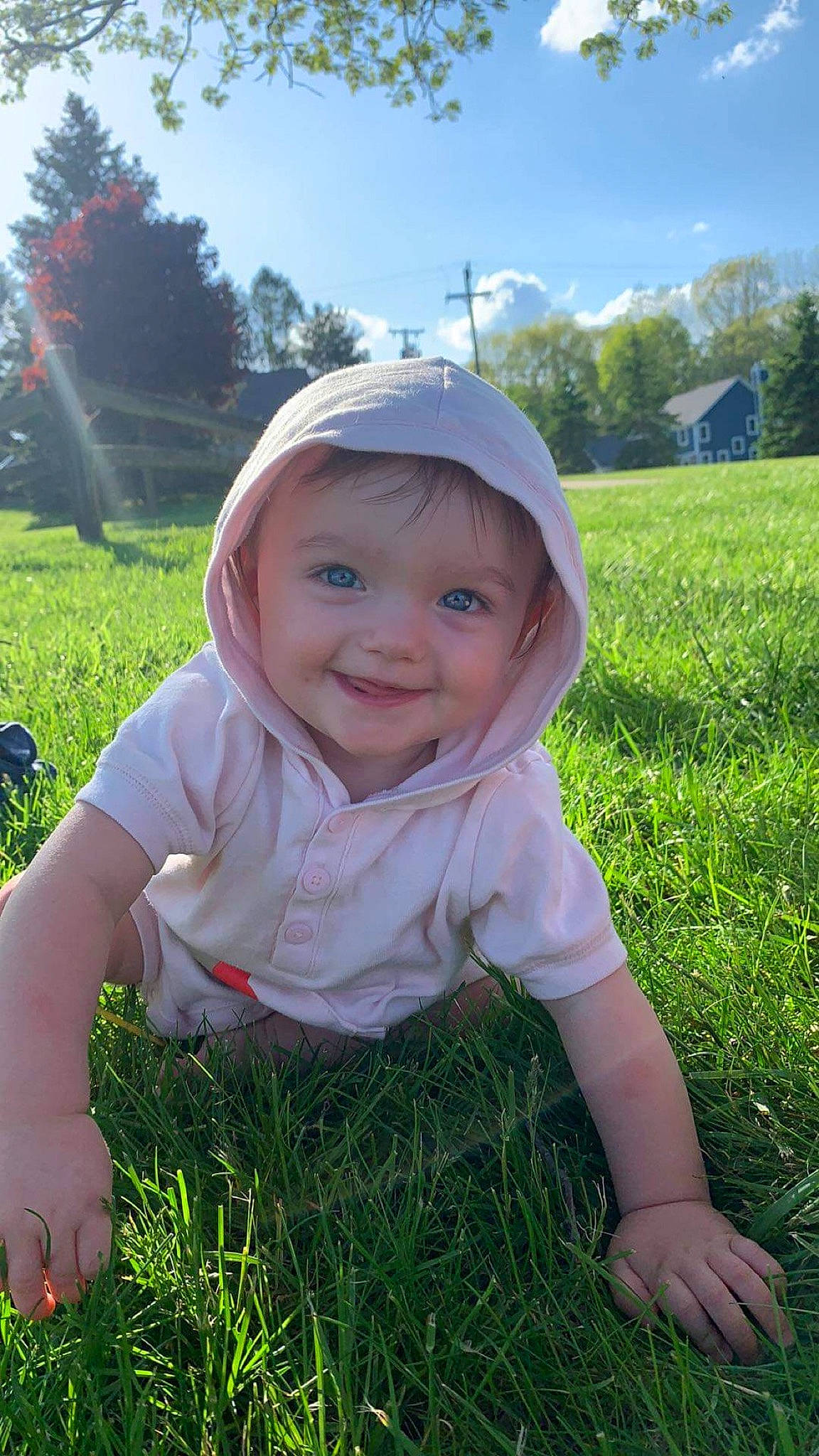 Kaylyn is registered to the contest to win money with this photo: baby_toddler_clothing, eye, facial_expression, fun, grass, grassland, happy, hat, head, headwear, joy, light, natural_environment, people_in_nature, person, plant, skin, sky, smile, standing