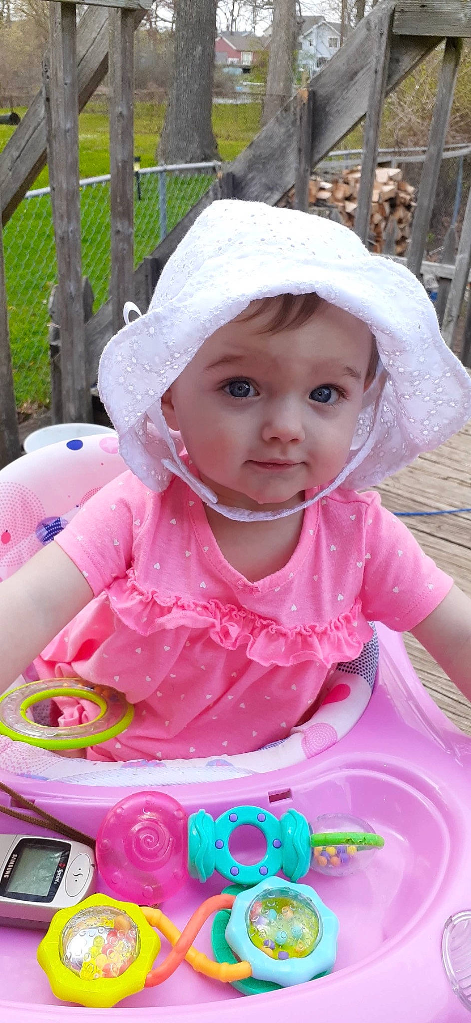 Kaylyn joined the competition — help win amazing prizes! baby, baby_products, baby_toddler_clothing, cap, cheek, child, fashion_accessory, fence, fun, grass, happy, headwear, leisure, lip, magenta, person, pink, product, recreation, skin