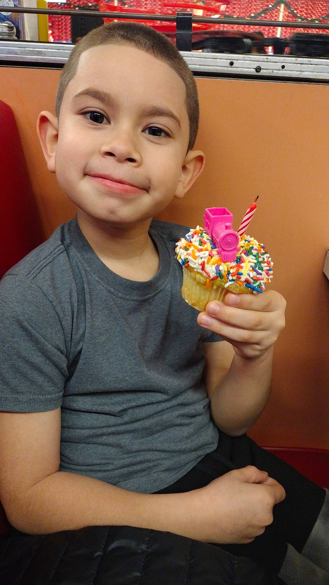 Noah is registered to the contest to win money with this photo: birthdaycake, boy, cake, child, clothing, cream, cupcake, dessert, face, food, head, icecream, icing, male, people, person, photography, portrait, sweets, t_shirt