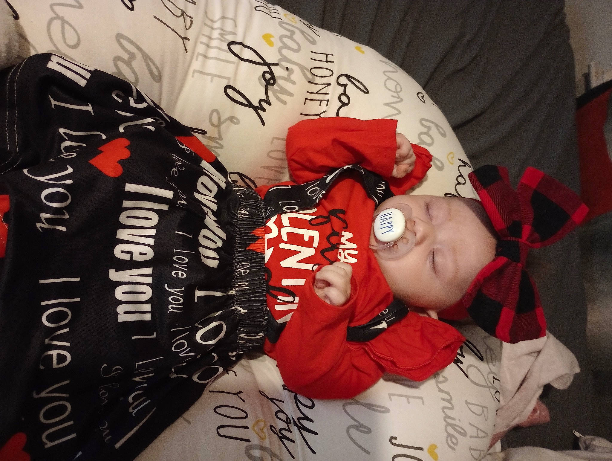 Ellie is registered to the contest to win money with this photo: advertising, baby, carmine, comfort, event, fashion_accessory, font, graphic_design, headwear, person, plant, room, sleeve, t_shirt, toddler