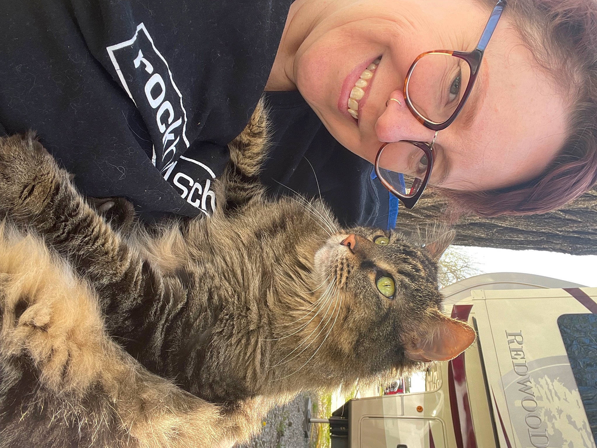 Bella is registered to the contest to win money with this photo: claw, domestic_short_haired_cat, eyewear, felidae, fur, glasses, grass, happy, mammal, skin, small_to_medium_sized_cats, smile, snout, tail, terrestrial_animal, vertebrate, vision_care, whiskers, wildlife, wildlife_biologist