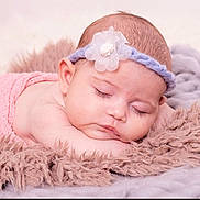 Ella joined the competition — help win amazing prizes! baby, sleeping, headband, flower, blanket, soft_texture, peaceful, closeup, infant, resting, cute, skin, child, portrait, pink, purple, cozy, toddler, nap, relaxation