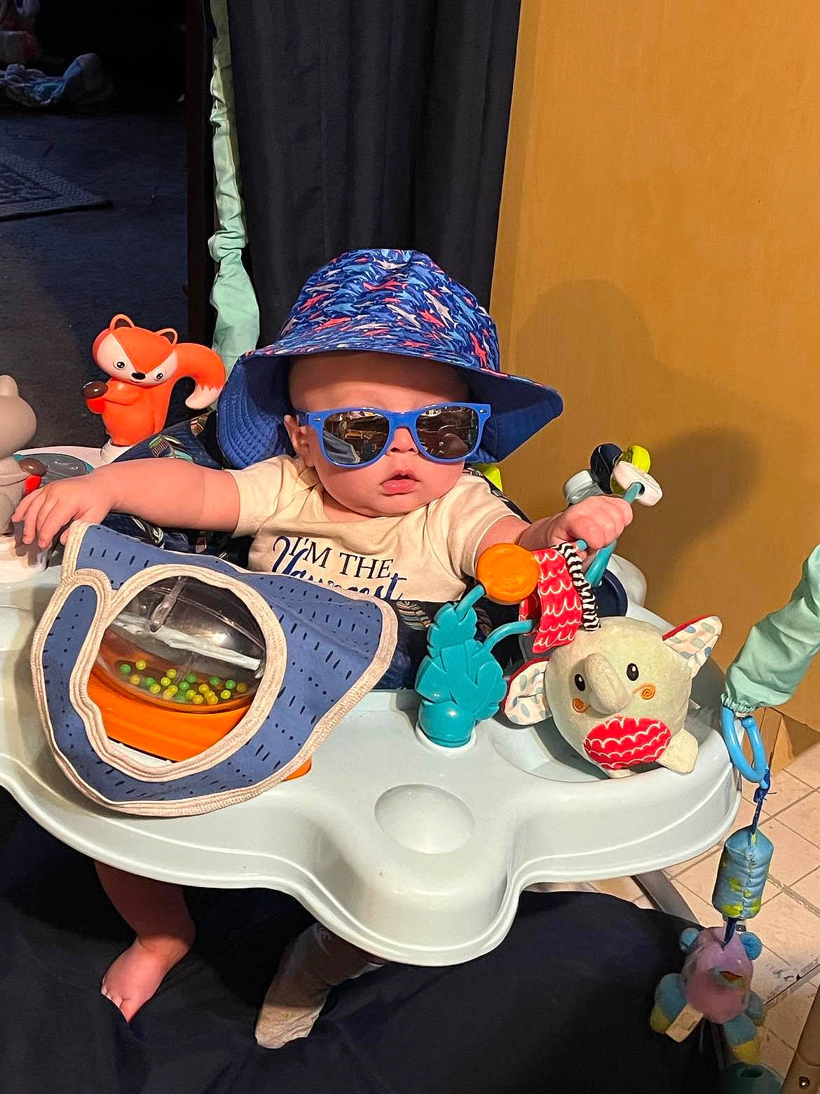 Jameson is registered to the contest to win money with this photo: baby_toddler_clothing, baseball_cap, cap, child, costume_hat, entertainment, event, eyewear, fashion_accessory, fun, goggles, hat, headgear, headwear, person, personal_protective_equipment, recreation, sun_hat, sunglasses, toddler