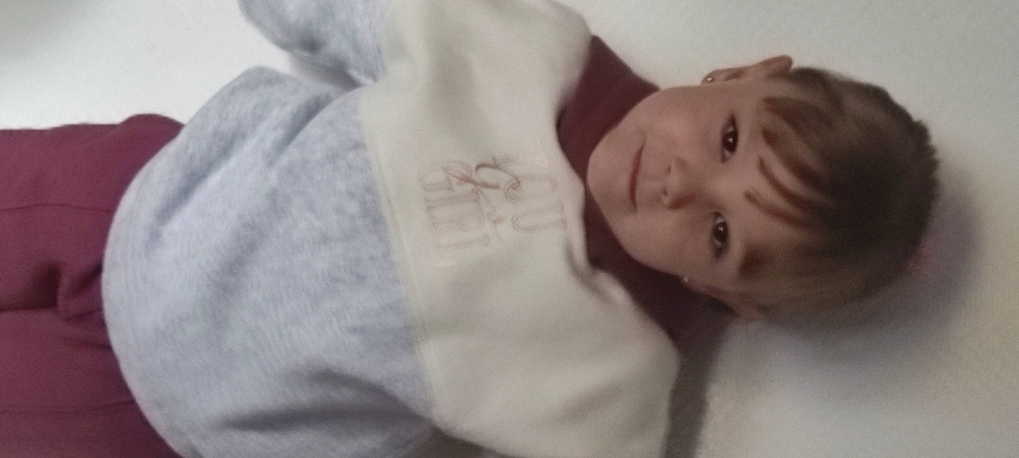 Alyson participe au concours pour gagner de l'argent avec cette photo : arm, baby, bedding, child, comfort, ear, elbow, eyebrow, eyelash, fur, gesture, happy, iris, linens, lip, neck, nose, person, sleeve, smile