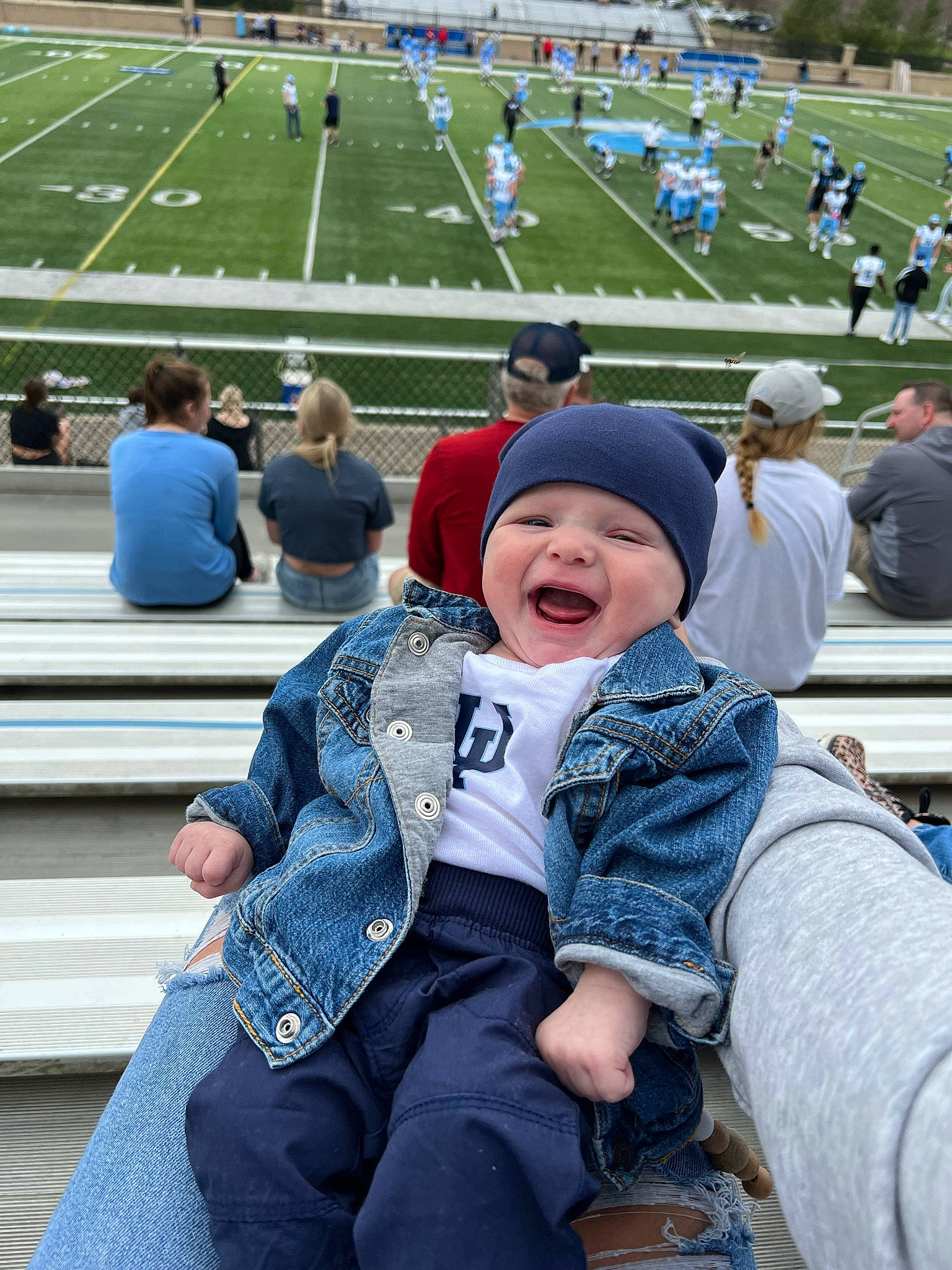 Oakland joined the competition — help win amazing prizes! american_football, clothing, competition_event, crowd, event, fan, grass, happy, headgear, headwear, leisure, people, person, recreation, smile, sport_venue, sports, stadium, super_bowl, team_sport