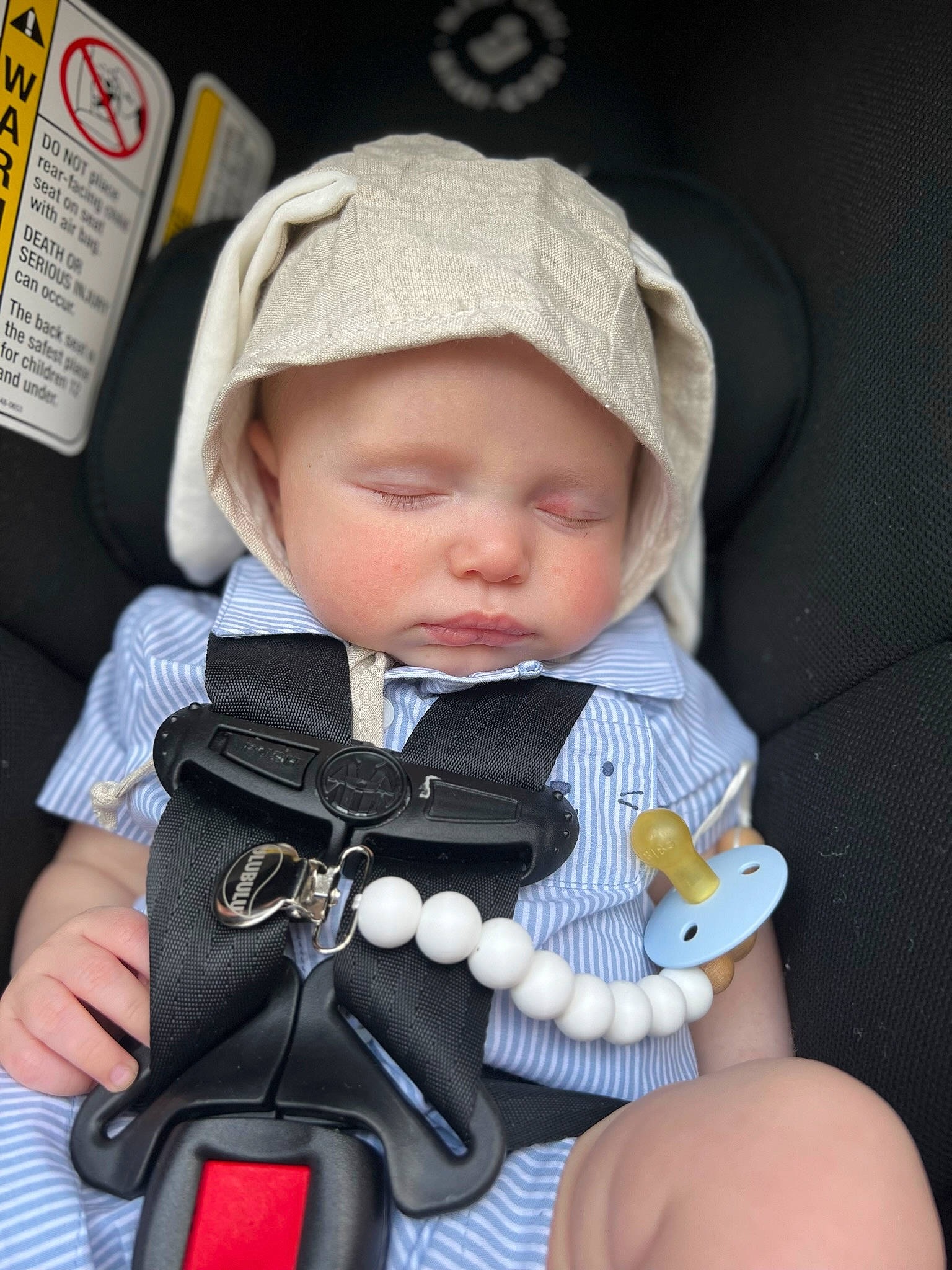 Oakland is registered to the contest to win money with this photo: baby, baby_carriage, baby_products, baby_toddler_clothing, cap, car_seat, cheek, child, cool, dress, eye, face, headwear, lip, nail, outerwear, person, product, sitting, skin