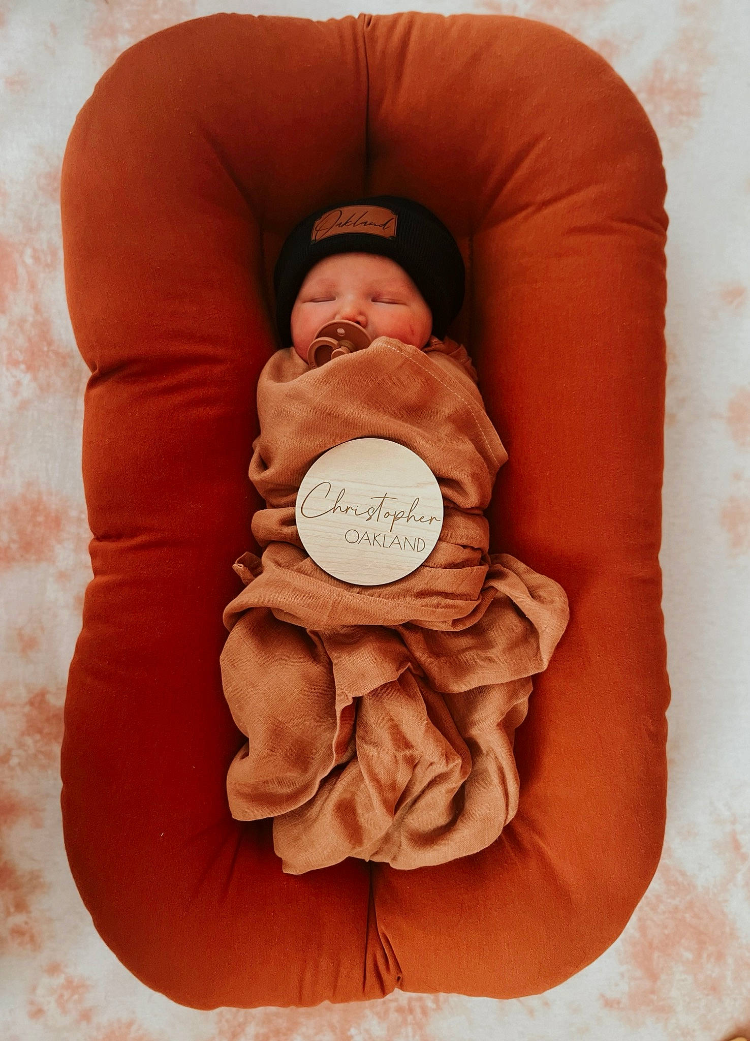 Oakland joined the competition — help win amazing prizes! art, baby, baby_sleeping, child, chin, circle, comfort, dishware, flesh, flower, headwear, linens, pattern, peach, person, petal, portrait_photography, sitting, still_life_photography, sweetness