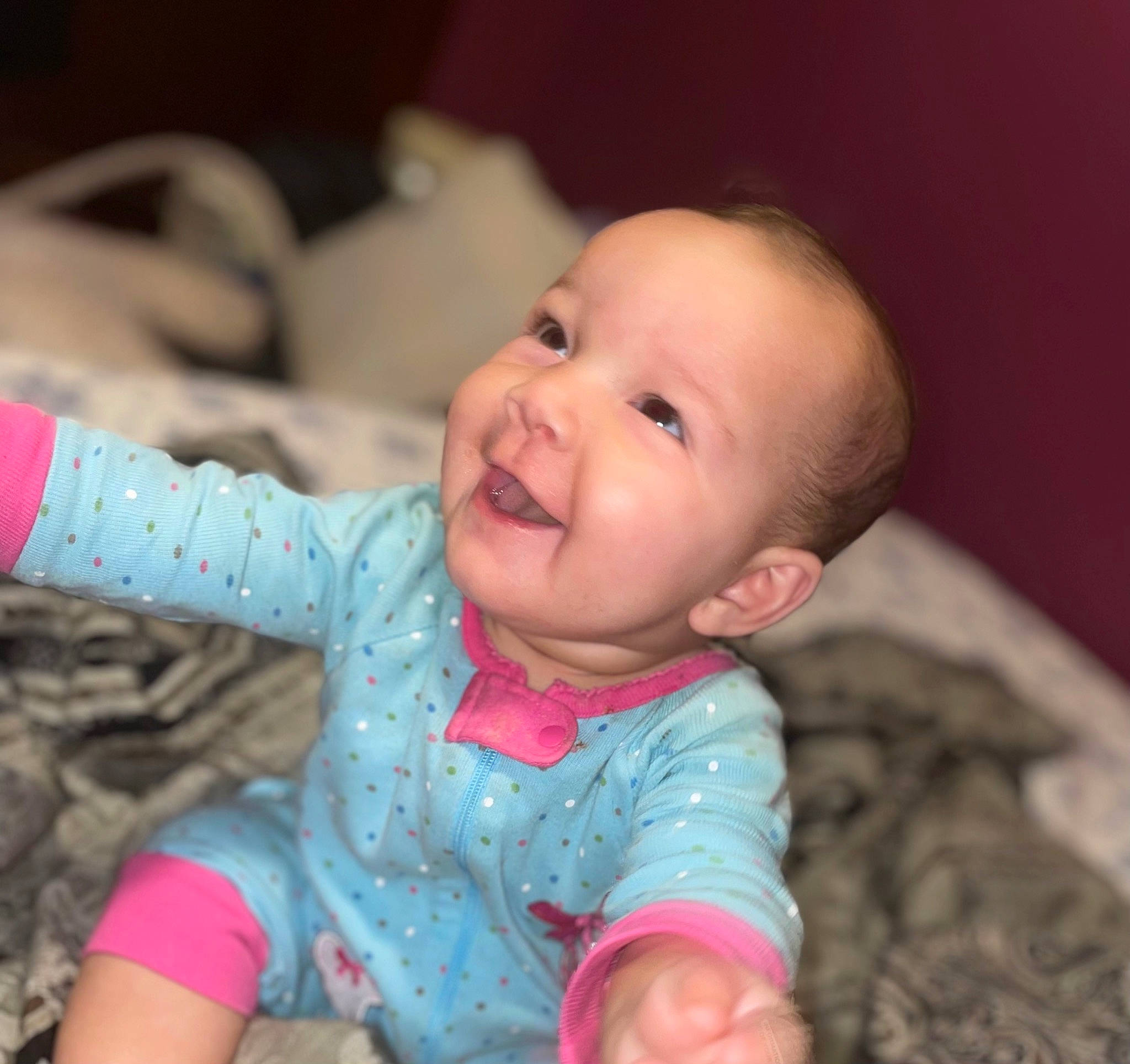 Kaylina is registered to the contest to win money with this photo: arm, baby, baby_toddler_clothing, cheek, eye, facial_expression, gesture, hand, happy, head, human_body, iris, lip, mouth, neck, nose, person, pink, skin, sleeve