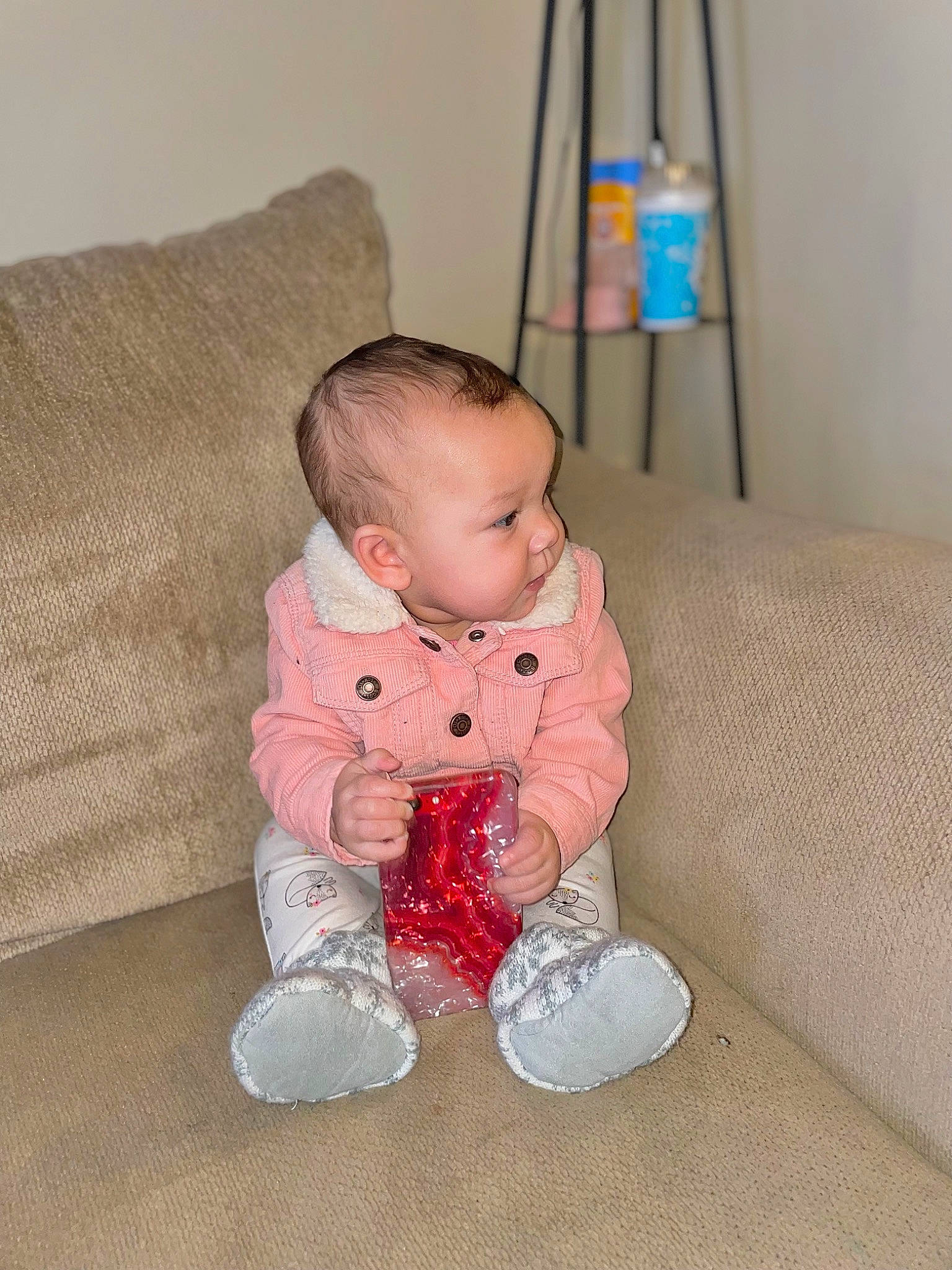 Kaylina joined the competition — help win amazing prizes! baby, baby_toddler_clothing, carmine, cheek, child, comfort, couch, eye, face, flooring, foot, hardwood, head, human_leg, linens, person, room, sitting, sleeve, toddler