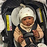 Corday joined the competition — help win amazing prizes! baby, car_seat, infant, hat, clothing, straps, safety, cute, indoor, child, person, seat, fabric, pattern, expression, adorable, sitting, headwear, small_hands, comfort