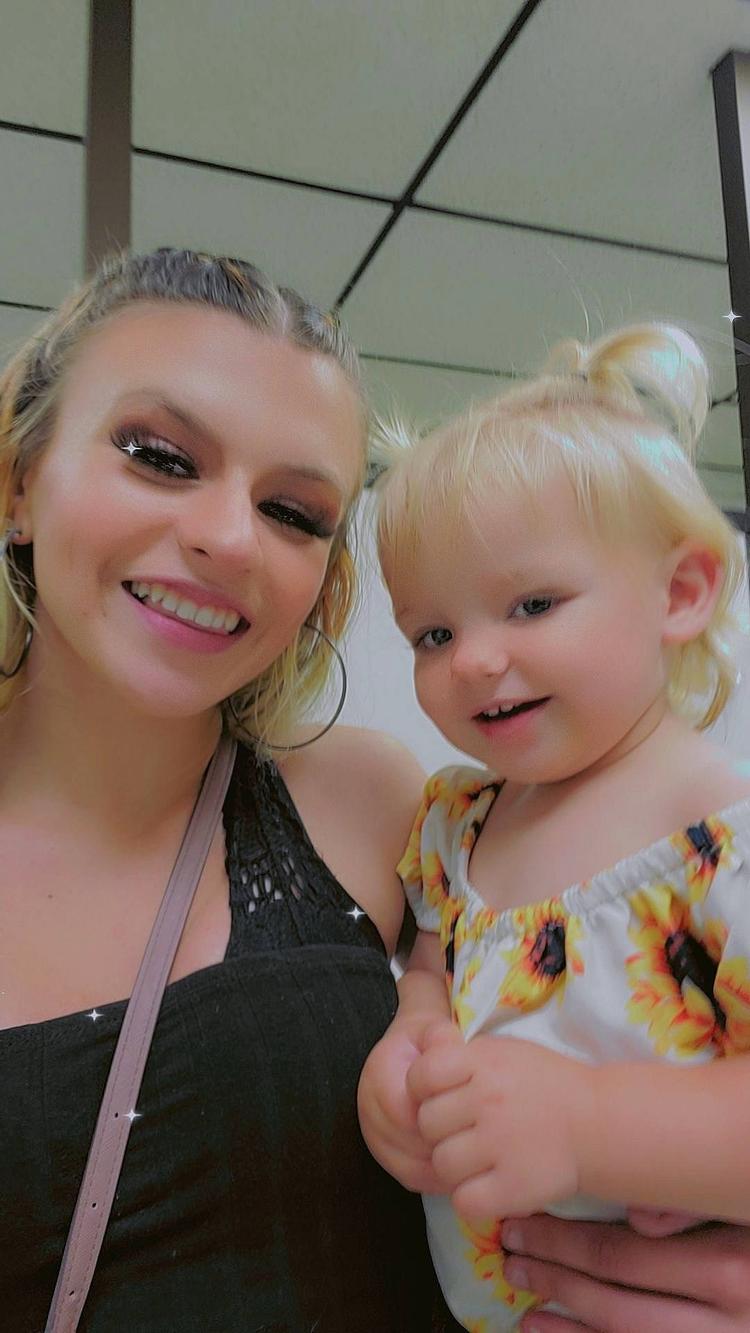 Layla is registered to the contest to win money with this photo: baby, baby_toddler_clothing, blond, cheek, chin, dress, event, eye, eyelash, face, fun, gesture, happy, iris, jewellery, joy, lip, necklace, person, skin