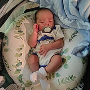 Ryzer joined the competition — help win amazing prizes! newborn, baby, pacifier, sleeping, blanket, pillow, soft, blue, white, clothing, infant, cute, resting, indoors, peaceful, hand, foot, leaf_pattern, text, good_night