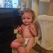 Letty a rejoint le concours — aidez-le/la à gagner de superbes lots ! baby, cat_tree, child, cute, diaper, face, feet, furniture, hair_bun, hammock, hands, happy, home, indoor, person, sitting, smiling, soft_texture, television, toddler
