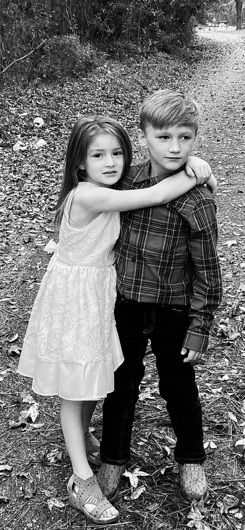 Virginia is registered to the contest to win money with this photo: black_and_white, child, child_model, design, gesture, grass, interaction, monochrome, monochrome_photography, people, people_in_nature, person, photograph, photography, sibling, smile, snapshot, standing, toddler, tree