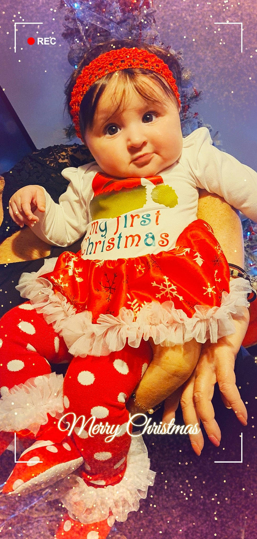 Célia a rejoint le concours — aidez-le/la à gagner de superbes lots ! baby_toddler_clothing, child, costume, day_dress, dress, event, face, happy, magenta, pattern, peach, person, pink, red, ruffle, sitting, skin, sleeve, thigh, toddler