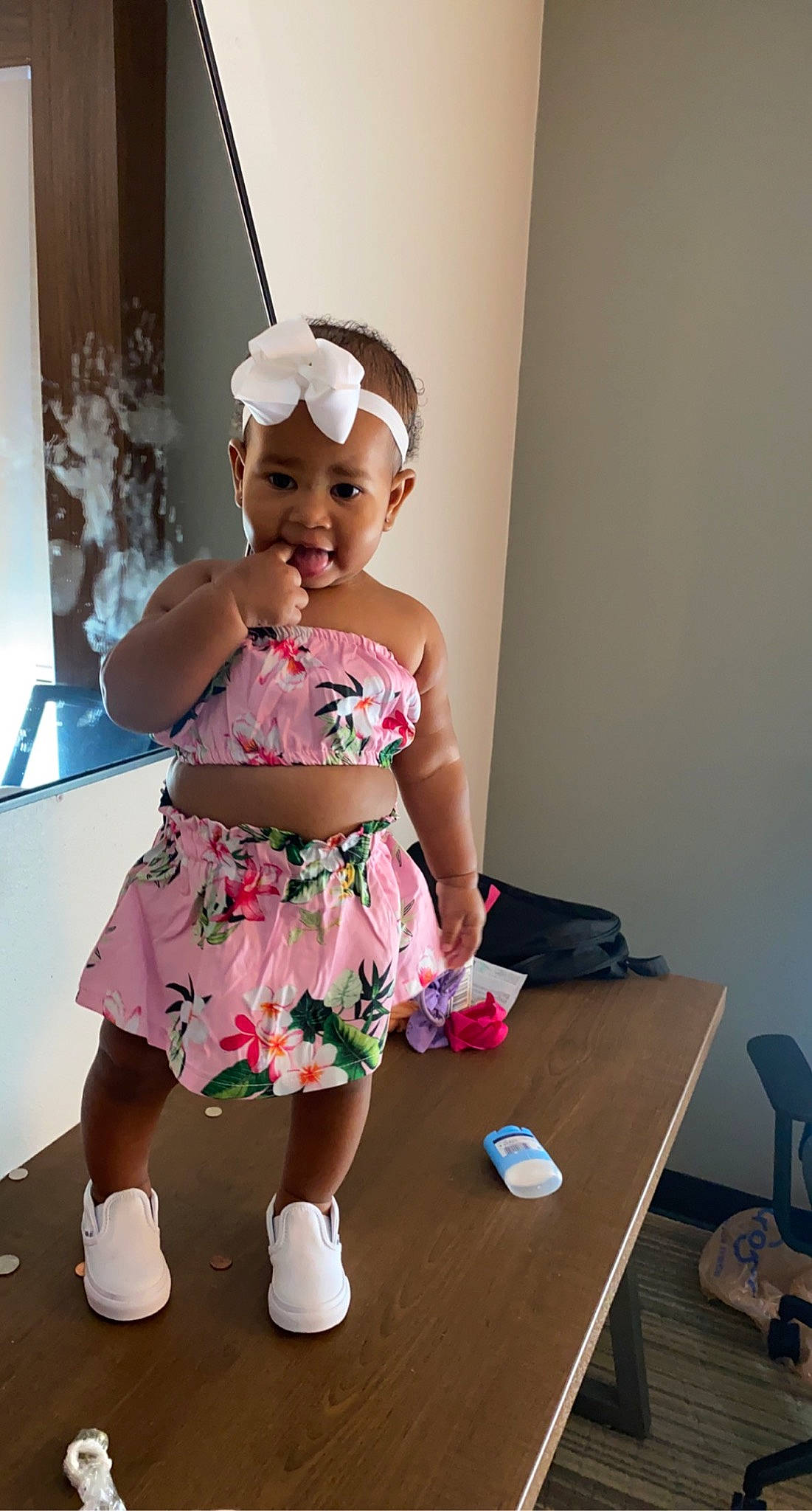 Amari'A is registered to the contest to win money with this photo: abdomen, baby_toddler_clothing, child, dress, event, fashion_design, fun, hairstyle, happy, headwear, human_leg, knee, magenta, person, plant, shoulder, smile, table, thigh, toddler
